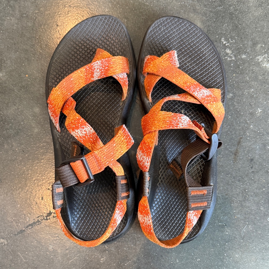Chaco Sandals With Orange Sole And Black Straps